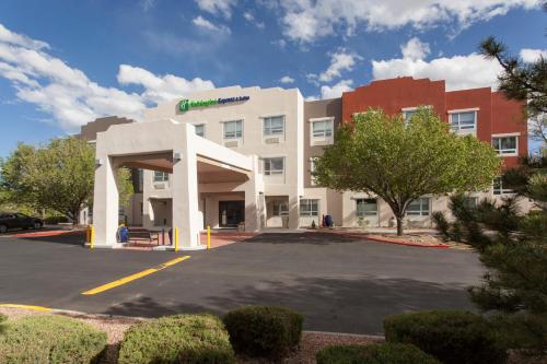 a building with a parking lot in front of it at  Holiday Inn Express & Suites in Santa Fe