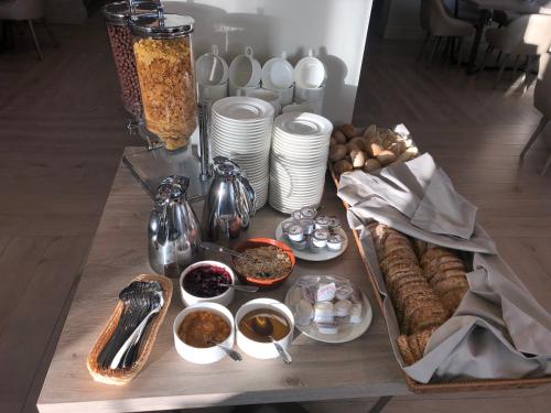 a table with a tray of food on top at Skałka Zieleniec in Duszniki Zdrój