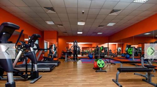 a gym with a bunch of exercise equipment in a room at AL MARSA in Dubai
