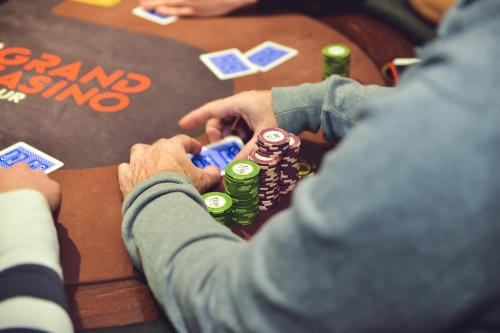 two people playing poker at a poker table at Mercure Namur Hotel in Namur