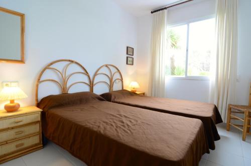 A bed or beds in a room at GREEN CLUB B 104