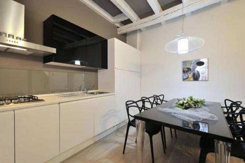 a kitchen with a table and chairs in a room at beautiful house in Venice in Venice