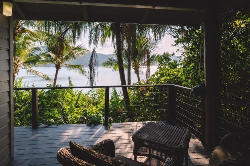 a porch with chairs and a view of the ocean at Palm Bay Resort in Long Island