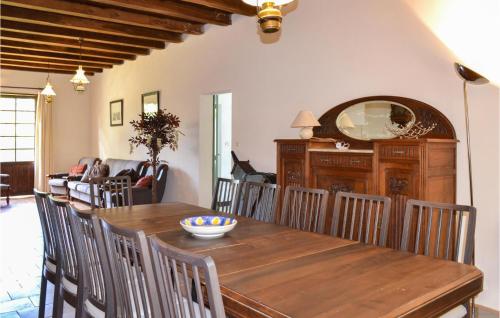 a dining room with a wooden table and chairs at Beautiful Home In Durfort Lacapelette in Durfort
