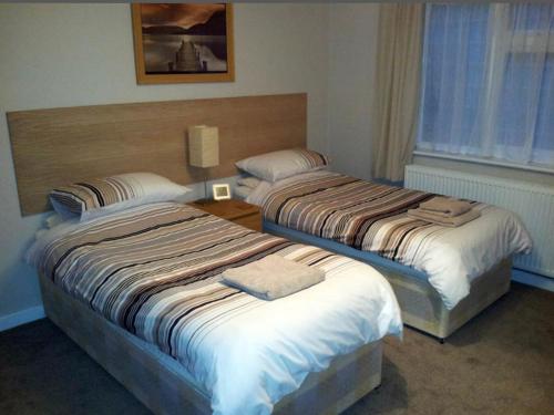 Ένα ή περισσότερα κρεβάτια σε δωμάτιο στο Black horse cottage