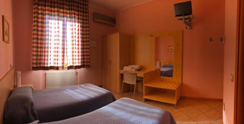 Ένα ή περισσότερα κρεβάτια σε δωμάτιο στο Da Nando Antica Osteria Hotel