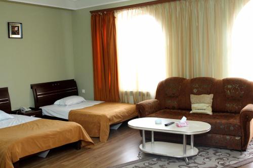 Ένα ή περισσότερα κρεβάτια σε δωμάτιο στο Golden Apricot