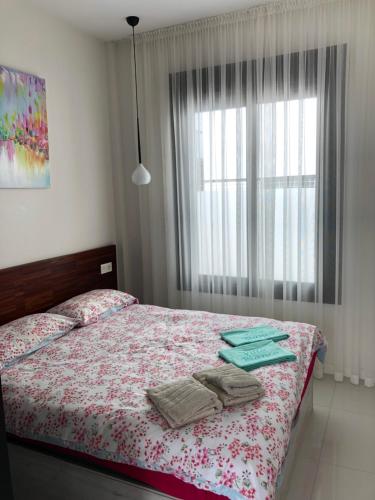 a bedroom with a bed with towels on it at Villa Bianco in Orihuela Costa