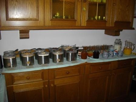 a kitchen counter with pots and pans on a stove at Gasthof Gangl in Schöder