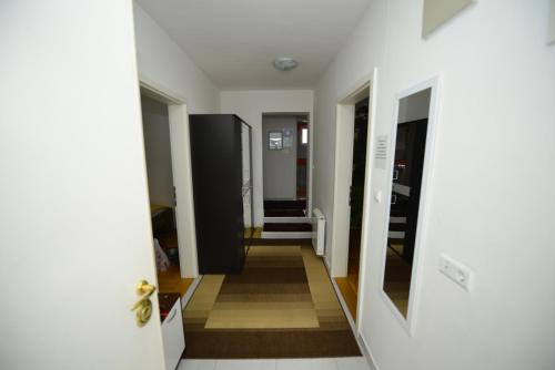 a hallway in a house with white walls at Apartment Mirela in Sarajevo