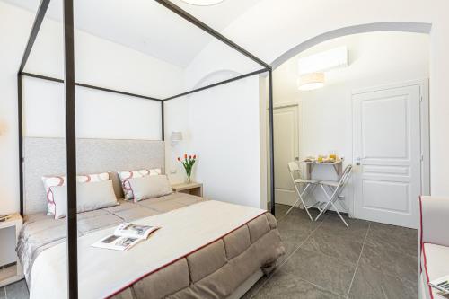 Кровать или кровати в номере la dimora di Cornelia