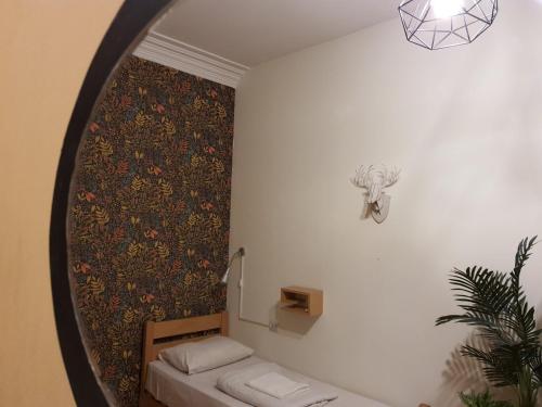 מיטה או מיטות בחדר ב-Envoy Hostel and Tours