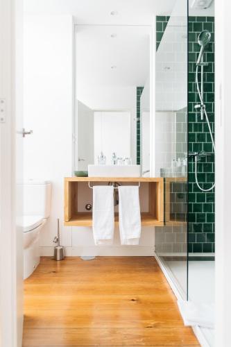 a bathroom with a sink and a shower at O da Joana in Porto