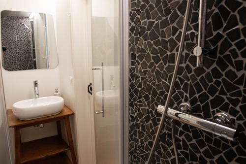 a bathroom with a sink and a mirror at Cosy House near market in Bruges