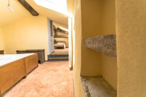 a hallway of a house with a kitchen and a stairway at Albergo Diffuso Ca' Spiga in Laglio
