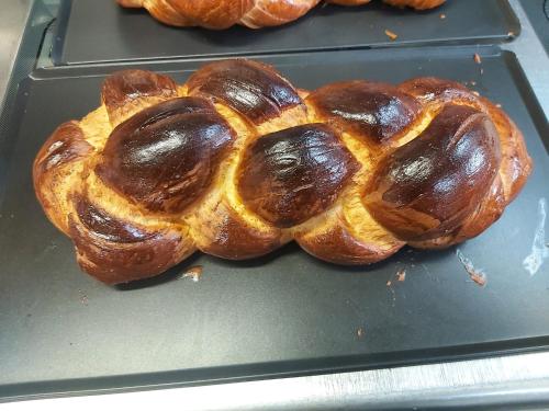 a loaf of bread sitting on top of a tray at Hotel Restaurant Bahnhof in Schüpfen