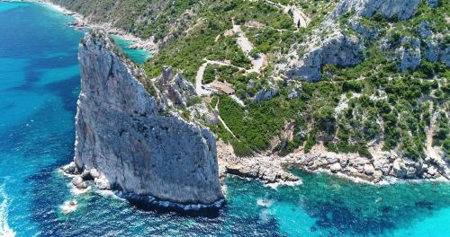 an aerial view of a rocky island in the ocean at Villa Sangemi in Àrbatax