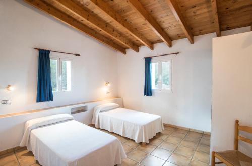 Postel nebo postele na pokoji v ubytování CASA EUGENIO Cala Saona