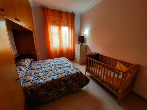 En eller flere senge i et værelse på FamilyBed Roma Monteverde-Vaticano