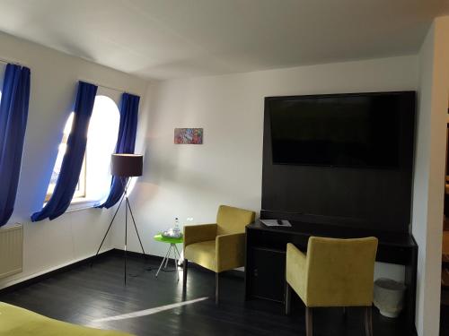 TV a/nebo společenská místnost v ubytování Hotel Milin