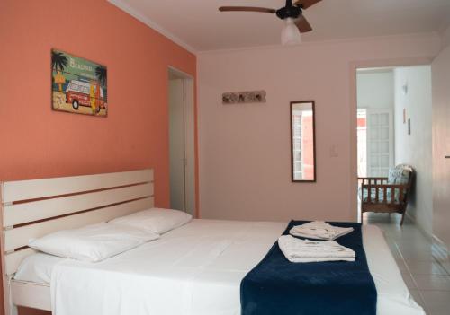 Cama ou camas em um quarto em Pousada Pantai Maresias