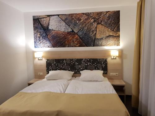 Postel nebo postele na pokoji v ubytování Hotel Milin