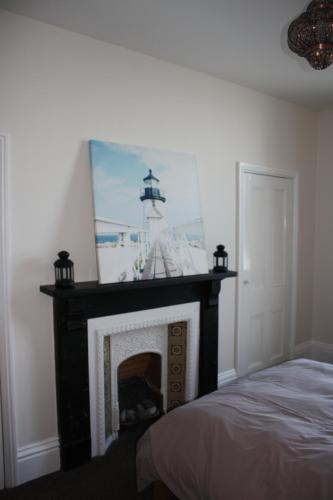 A bed or beds in a room at No3 By The Sea Apartment 