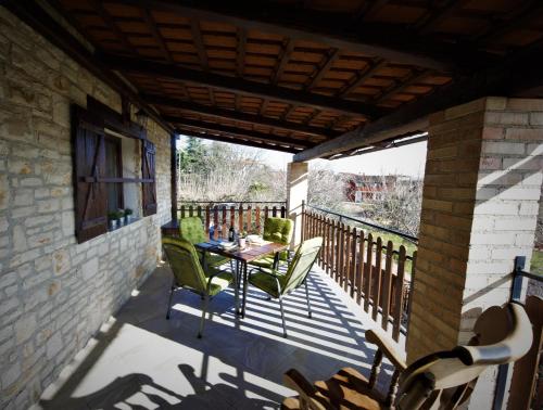 a patio with a table and chairs on a balcony at Apartments Oliva in Fiorini