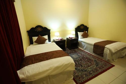 Ліжко або ліжка в номері Al Eairy Apartments - Al-Damam 2