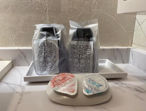 a couple of packages of toothbrushes sitting on a counter at Hotel Regent (Adult Only) in Nagoya