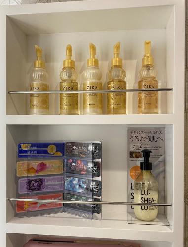 a refrigerator filled with lots of bottles of honey at Hotel Regent (Adult Only) in Nagoya