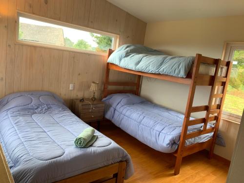 Двох'ярусне ліжко або двоярусні ліжка в номері Casa Exclusiva en Puerto Octay - Espectacular Vista