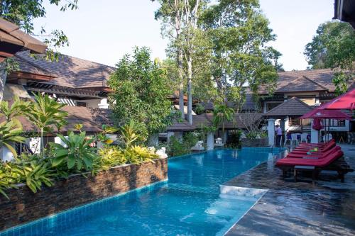 a swimming pool in the middle of a resort at Samed Pavilion Resort in Ko Samed