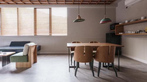 a kitchen with a dining room table and chairs at Hotel Aoka Kamigoto in Shinkamigoto