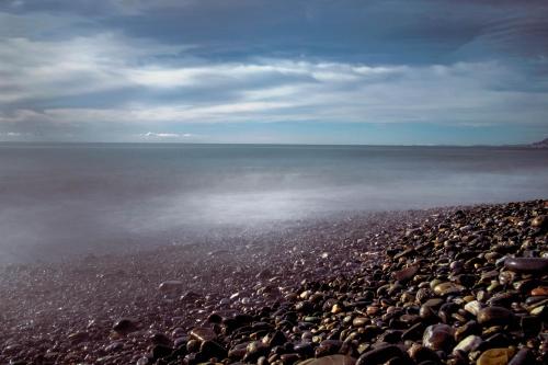 a large group of rocks on a beach at Sui Tetti, Caressa de mä in Bordighera