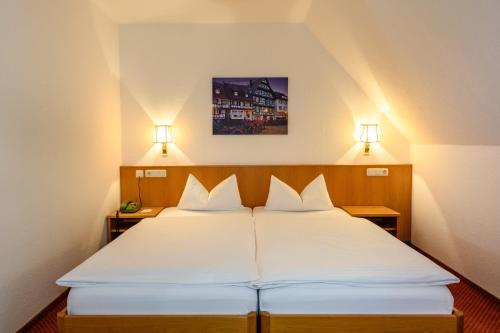 Cama o camas de una habitación en Ringhotel garni Pflug