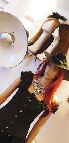 a woman with red hair and a hat on a ceiling at Studio Appartement in Speichersdorf