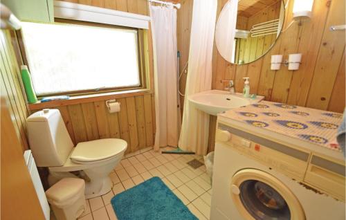 a bathroom with a toilet and a sink at Holiday Home Birkely Nysted Denm in Nysted