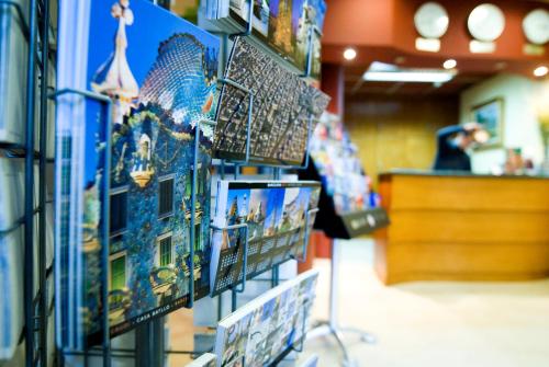 a display of pictures on a wall in a store at Hotel Ciutat De Sant Adria in Sant Adria de Besos
