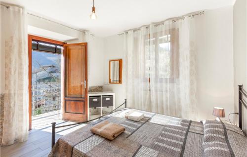 a bedroom with a bed and a large window at Lovely Apartment In Gioviano -lu- With Kitchen in Ghivizzano