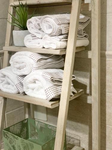 a pile of towels on a towel rack at Trullo Labellavita in Putignano