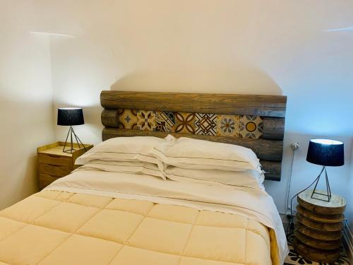 מיטה או מיטות בחדר ב-Trullo Labellavita