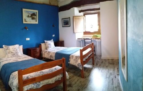 A bed or beds in a room at EL CAMPANARIO