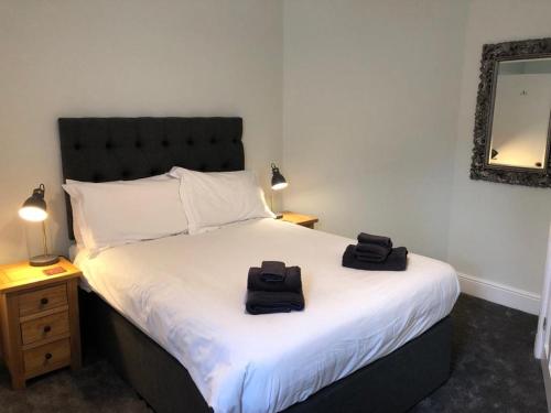 A bed or beds in a room at The Grove 