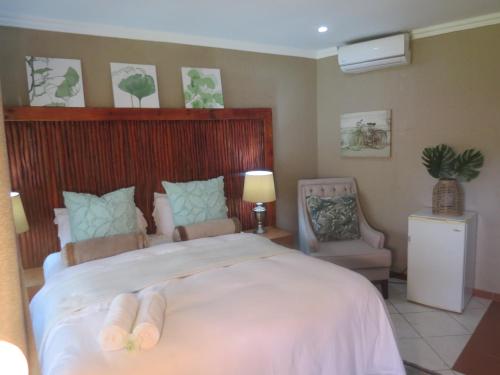 Nkanhi Centro de Conferências e Hotel 객실 침대