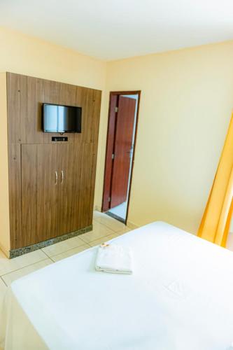 Ένα ή περισσότερα κρεβάτια σε δωμάτιο στο Hotel Trilhos de Minas
