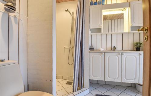 a bathroom with a shower and a sink at Klitborgen in Harboør