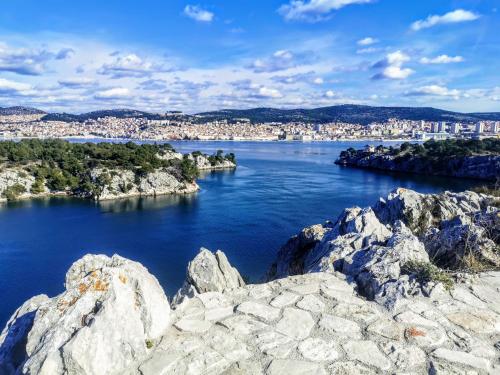 a view of a river with a city in the background at Apartmani Krnić in Šibenik