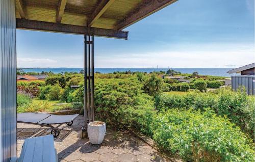 a view of the ocean from the porch of a house at Holiday Home Kløverbakken in Slagelse