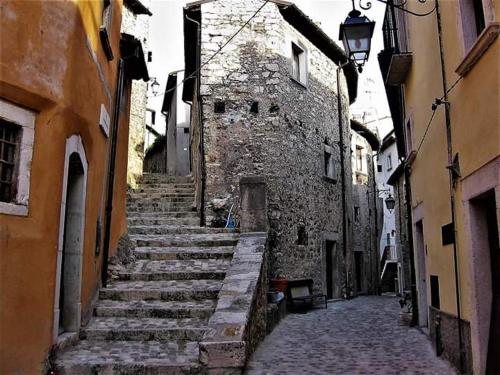 an alley with stairs in an old stone building at Casa Stefania in Barrea